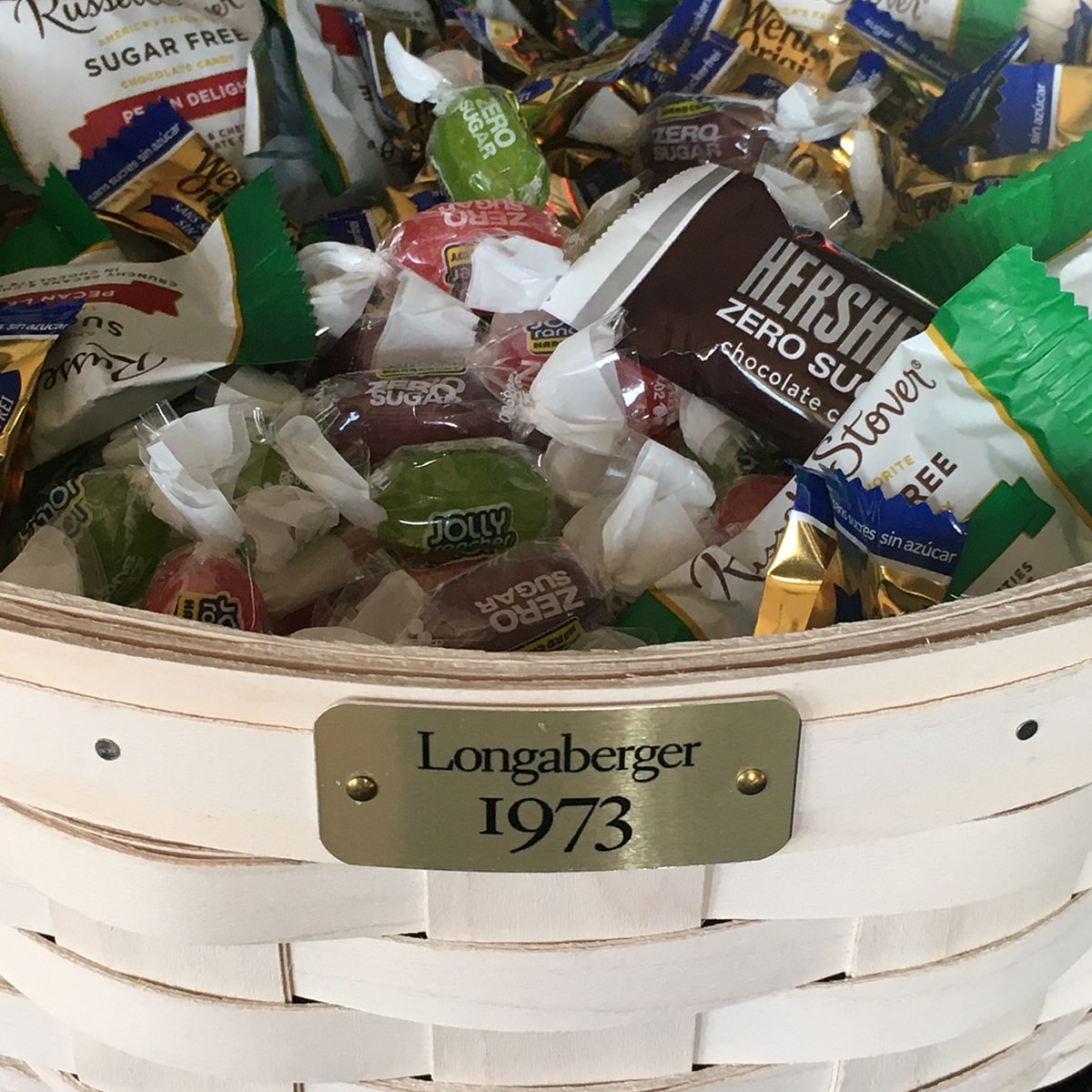 White Longaberger basket filled with candy